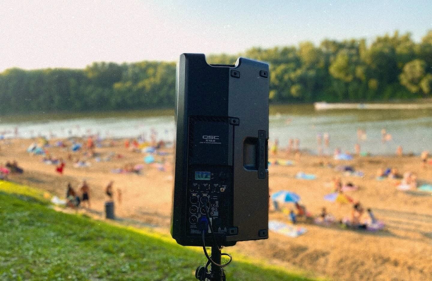 QSC powered speaker at an outdoor event